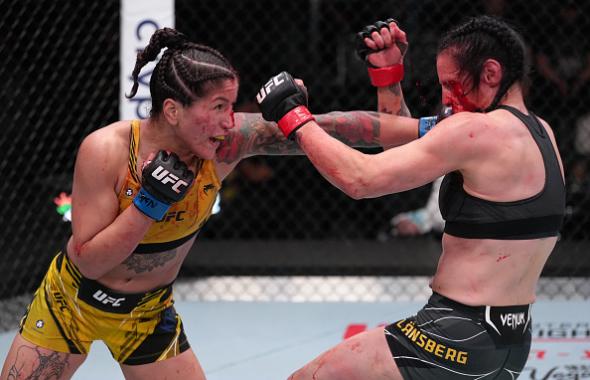 Pannie Kianzad of Iran punches Lina Lansberg of Sweden in a bantamweight fight during the UFC Fight Night event at UFC APEX on April 16, 2022 in Las Vegas, Nevada. (Photo by Jeff Bottari/Zuffa LLC)