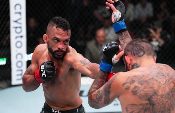 Rob Font punches Marlon Vera of Ecuador in a bantamweight fight during the UFC Fight Night event at UFC APEX on April 30, 2022 in Las Vegas, Nevada. (Photo by Chris Unger/Zuffa LLC)