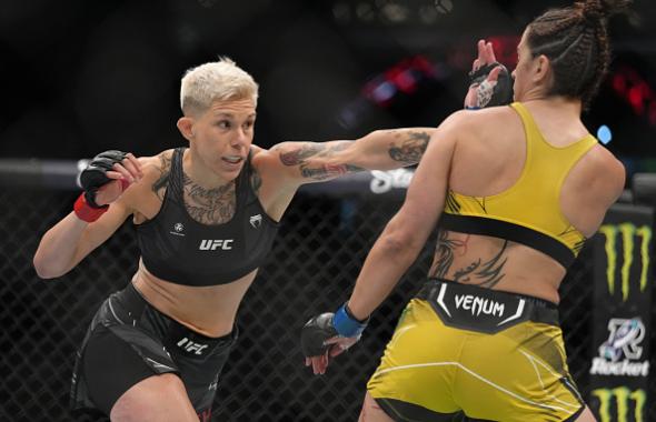Macy Chiasson punches Norma Dumont of Brazil in a featherweight fight during the UFC 274 event at Footprint Center on May 07, 2022 in Phoenix, Arizona. (Photo by Jeff Bottari/Zuffa LLC)
