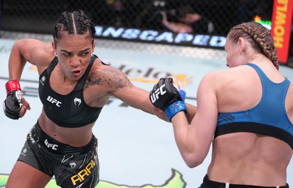 Viviane Araujo of Brazil punches Andrea Lee in a flyweight fight at UFC APEX on May 14, 2022 in Las Vegas, Nevada. (Photo by Jeff Bottari/Zuffa LLC)