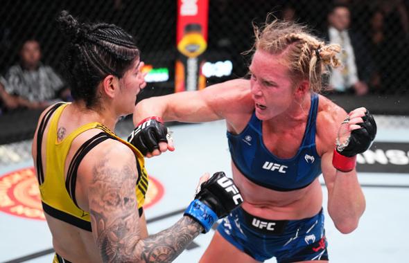 Holly Holm punches Ketlen Vieira of Brazil in a bantamweight bout during the UFC Fight Night event at UFC APEX on May 21, 2022 in Las Vegas, Nevada. (Photo by Chris Unger/Zuffa LLC)