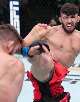 Arman Tsarukyan of Georgia kicks Mateusz Gamrot of Poland in a lightweight fight during the UFC Fight Night event at UFC APEX on June 25, 2022 in Las Vegas, Nevada. (Photo by Jeff Bottari/Zuffa LLC)
