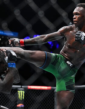 Israel Adesanya of Nigeria kicks Jared Cannonier in the UFC middleweight championship fight during the UFC 276 event at T-Mobile Arena on July 02, 2022 in Las Vegas, Nevada. (Photo by Chris Unger/Zuffa LLC)