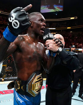Israel Adesanya of Nigeria reacts after knocking out Alex Pereira of Brazil in the UFC middleweight championship fight during the UFC 287 event at Kaseya Center on April 08, 2023 in Miami, Florida. (Photo by Jeff Bottari/Zuffa LLC Getty Images)
