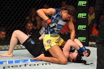 FAIRFAX, VA - APRIL 04:  (L-R) Juliana Pena punches Milana Dudieva on the ground in their women's bantamweight fight during the UFC Fight Night event at the Patriot Center on April 4, 2015 in Fairfax, Virginia. (Photo by Josh Hedges/Zuffa LLC via Getty Images)