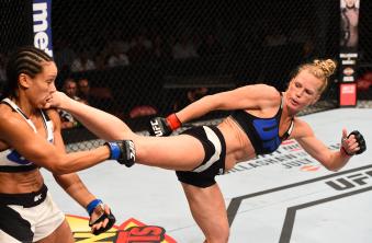 SAN DIEGO, CA - JULY 15:   (R-L) Holly Holm kicks Marion Reneau in their women's bantamweight bout during the UFC event at the Valley View Casino Center on July 15, 2015 in San Diego, California. (Photo by Jeff Bottari/Zuffa LLC via Getty Images)
