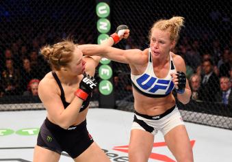 Holly Holm punches Ronda Rousey in their UFC women's bantamweight championship bout during the UFC 193 event at Etihad Stadium on November 15, 2015 in Melbourne, Australia. 