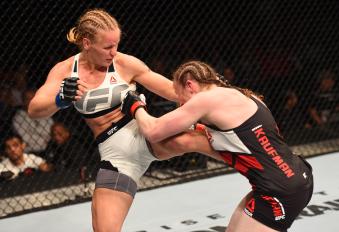 ORLANDO, FL - DECEMBER 19:   (L-R) Valentina Shevchenko kicks Sarah Kaufman in their women's bantamweight bout during the UFC Fight Night event at the Amway Center on December 19, 2015 in Orlando, Florida. (Photo by Josh Hedges/Zuffa LLC via Getty Images)