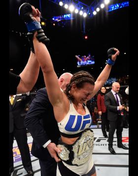 Miesha Tate reacts to her victory over Holly Holm in their UFC women's bantamweight championship bout during the UFC 196 event inside MGM Grand Garden Arena on March 5, 2016 in Las Vegas, Nevada. (Photo by Josh Hedges/Zuffa Getty Images)