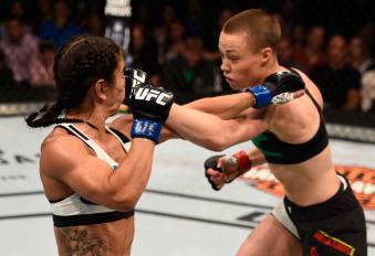 TAMPA, FL - APRIL 16:  (R-L) Rose Namajunas punches Tecia Torres in their women's strawweight bout during the UFC Fight Night event at Amalie Arena on April 16, 2016 in Tampa, Florida. (Photo by Jeff Bottari/Zuffa LLC via Getty Images)
