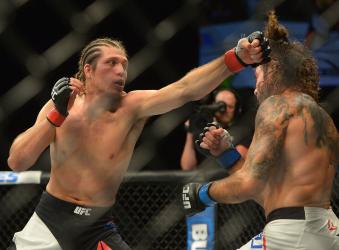 Brian Ortega punches Clay Guida at The Forum on June 4, 2016 in Inglewood, California.