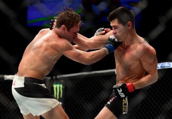 Dominick Cruz punches Urijah Faber in their UFC bantamweight championship bout during the UFC 199 event at The Forum on June 4, 2016 in Inglewood, California.
