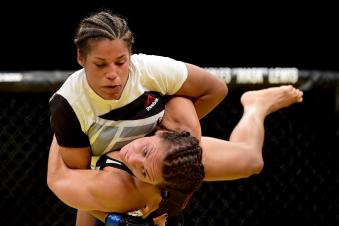 Julianna Pena takes down Cat Zigano in their women's bantamweight bout during the UFC 200 event on July 9, 2016 at T-Mobile Arena in Las Vegas, Nevada.