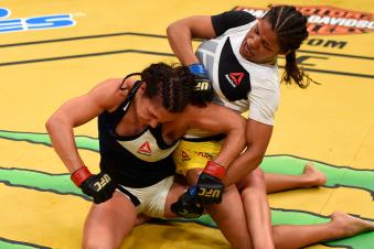 Julianna Pena fights Cat Zigano in their women's bantamweight bout during the UFC 200 event on July 9, 2016 at T-Mobile Arena in Las Vegas, Nevada.