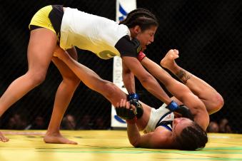 Julianna Pena fights Cat Zigano in their women's bantamweight bout during the UFC 200 event on July 9, 2016 at T-Mobile Arena in Las Vegas, Nevada.