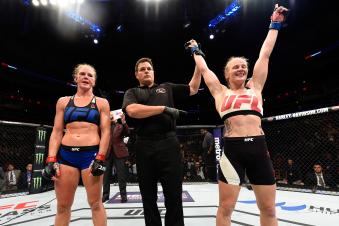 CHICAGO, IL - JULY 23:  (R-L) Valentina Shevchenko of Kyrgyzstan celebrates after defeating Holly Holm by unanimous decision in their women's bantamweight bout during the UFC Fight Night event at the United Center on July 23, 2016 in Chicago, Illinois. (Photo by Josh Hedges/Zuffa LLC via Getty Images)