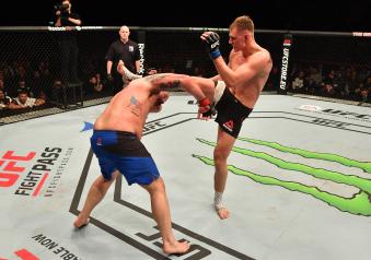 BELFAST, NORTHERN IRELAND - NOVEMBER 19:  (R-L) Alexander Volkov of Russia kicks Timothy Johnson in their heavyweight bout during the UFC Fight Night at the SSE Arena on November 19, 2016 in Belfast, Northern Ireland. (Photo by Brandon Magnus/Zuffa LLC via Getty Images)