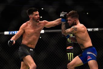Dominick Reyes punches Cody Garbrandt in their UFC bantamweight championship bout during the UFC 207 event at T-Mobile Arena on December 30, 2016 in Las Vegas, Nevada.