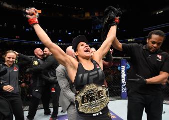 Amanda Nunes celebrates her win over Ronda Rousey in their UFC women's bantamweight championship bout during the UFC 207 event at T-Mobile Arena on December 30, 2016 in Las Vegas, Nevada.