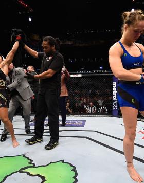 Amanda Nunes of Brazil (left) reacts to her victory over Ronda Rousey (right) in their UFC women's bantamweight championship bout during the UFC 207 event at T-Mobile Arena on December 30, 2016 in Las Vegas, Nevada. (Photo by Jeff Bottari/Zuffa Getty Images)