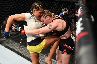DENVER, CO - JANUARY 28:  (L-R) Julianna Pena knees Valentina Shevchenko of Kyrgyzstan in their women's bantamweight bout during the UFC Fight Night event at the Pepsi Center on January 28, 2017 in Denver, Colorado. (Photo by Josh Hedges/Zuffa LLC via Getty Images)