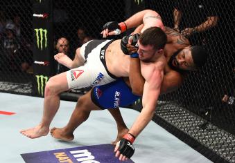HOUSTON, TX - FEBRUARY 04:  (R-L) Curtis Blaydes takes down Adam Milstead in their heavyweight bout during the UFC Fight Night event at the Toyota Center on February 4, 2017 in Houston, Texas. (Photo by Jeff Bottari/Zuffa LLC via Getty Images)