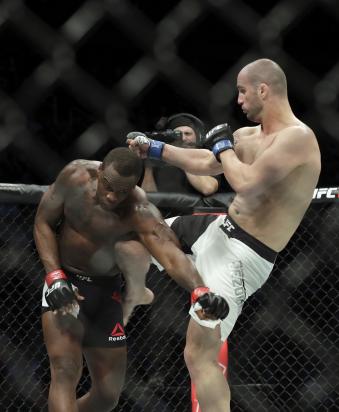 HOUSTON, TX - FEBRUARY 04: Volkan Oezdemir of Switzerland knees Ovince Saint Preux in the ribs in the second round in their light heavyweight bout during the UFC Fight Night event at the Toyota Center on February 4, 2017 in Houston, Texas. (Photo by Tim Warner/Getty Images)