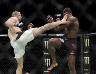 HOUSTON, TX - FEBRUARY 04:  Volkan Oezdemir (blue tape) kicks Ovince Saint Preux (red tape) in the Light Heavyweight Bout during UFC Fight Night at the Toyota Center on February 4, 2017 in Houston, Texas.  (Photo by Tim Warner/Getty Images)