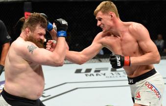 KANSAS CITY, MO - APRIL 15:  (R-L) Alexander Volkov of Russia punches Roy Nelson in their heavyweight fight during the UFC Fight Night event at Sprint Center on April 15, 2017 in Kansas City, Missouri. (Photo by Josh Hedges/Zuffa LLC via Getty Images)