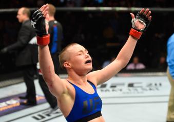 KANSAS CITY, MO - APRIL 15:  Rose Namajunas celebrates her submission victory over Michelle Waterson in their women's strawweight fight during the UFC Fight Night event at Sprint Center on April 15, 2017 in Kansas City, Missouri. (Photo by Josh Hedges/Zuffa LLC via Getty Images)
