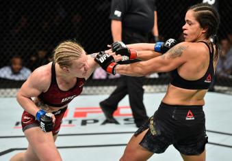 EDMONTON, AB - SEPTEMBER 09:  (L-R) Valentina Shevchenko of Kyrgyzstan punches Amanda Nunes of Brazil in their women's bantamweight bout during the UFC 215 event inside the Rogers Place on September 9, 2017 in Edmonton, Alberta, Canada. (Photo by Jeff Bottari/Zuffa LLC via Getty Images)