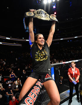 Amanda Nunes of Brazil celebrates her victory over Valentina Shevchenko of Kyrgyzstan in their women's bantamweight bout during the UFC 215 event inside the Rogers Place on September 9, 2017 in Edmonton, Alberta, Canada. (Photo by Jeff Bottari/Zuffa LLC)