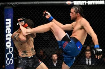 FRESNO, CA - DECEMBER 09:  (R-L) Brian Ortega kicks Cub Swanson in their featherweight bout during the UFC Fight Night event inside Save Mart Center on December 9, 2017 in Fresno, California. (Photo by Jeff Bottari/Zuffa LLC via Getty Images)