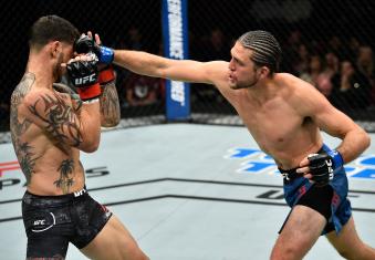 FRESNO, CA - DECEMBER 09:  (R-L) Brian Ortega punches Cub Swanson in their featherweight bout during the UFC Fight Night event inside Save Mart Center on December 9, 2017 in Fresno, California. (Photo by Jeff Bottari/Zuffa LLC via Getty Images)
