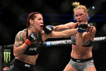 LAS VEGAS, NV - DECEMBER 30:  (L-R) Cris Cyborg of Brazil and Holly Holm trade punches in their women's featherweight bout during the UFC 219 event inside T-Mobile Arena on December 30, 2017 in Las Vegas, Nevada. (Photo by Brandon Magnus/Zuffa LLC via Getty Images)