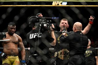 BOSTON, MA - JANUARY 20: (R-L) Stipe Miocic celebrates his victory over Francis Ngannou of Cameroon in their heavyweight championship bout during the UFC 220 event at TD Garden on January 20, 2018 in Boston, Massachusetts. (Photo by Brandon Magnus/Zuffa LLC/Zuffa LLC via Getty Images)