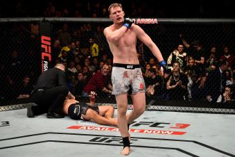 LONDON, ENGLAND - MARCH 17:  (R-L) Alexander Volkov of Russia reacts after defeating Fabricio Werdum of Brazil in their heavyweight bout inside The O2 Arena on March 17, 2018 in London, England. (Photo by Brandon Magnus/Zuffa LLC via Getty Images)