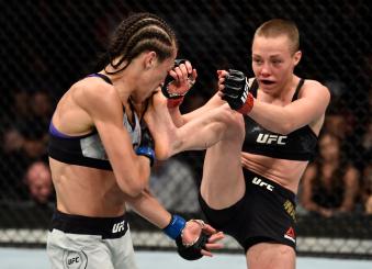 BROOKLYN, NEW YORK - APRIL 07:  (R-L) Rose Namajunas kicks Joanna Jedrzejczyk of Poland in their women's strawweight title bout during the UFC 223 event inside Barclays Center on April 7, 2018 in Brooklyn, New York. (Photo by Jeff Bottari/Zuffa LLC via Getty Images)