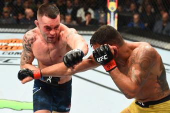 CHICAGO, ILLINOIS - JUNE 09:  (L-R) Colby Covington punches Rafael Dos Anjos of Brazil in their interim welterweight title fight during the UFC 225 event at the United Center on June 9, 2018 in Chicago, Illinois. (Photo by Josh Hedges/Zuffa LLC via Getty Images)