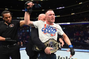 CHICAGO, ILLINOIS - JUNE 09:  UFC President Dana White places the interim welterweight championship belt on Colby Covington after defeating Rafael Dos Anjos of Brazil in their interim welterweight title fight during the UFC 225 event at the United Center on June 9, 2018 in Chicago, Illinois. (Photo by Josh Hedges/Zuffa LLC via Getty Images)