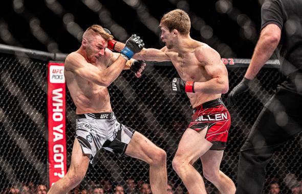 LONDON, ENGLAND - MARCH 19: (R-L) Arnold Allen punches Dan Hooker at O2 Arena on March 19, 2022 in London, England. (Photo by John Barry/Zuffa LLC)