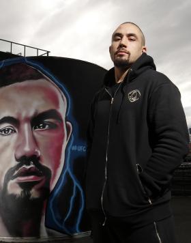 Robert Whittaker In Front of His Marvel Stadium Mural  (Photo by Darrian Traynor for Zuffa LLC)