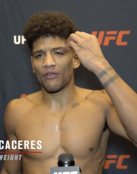 Alex Caceres reacts with UFC.com after his unanimous decision victory over featherweight Kevin Croom at UFC Fight Night: Rozenstruik vs Gane on February 27, 2021.